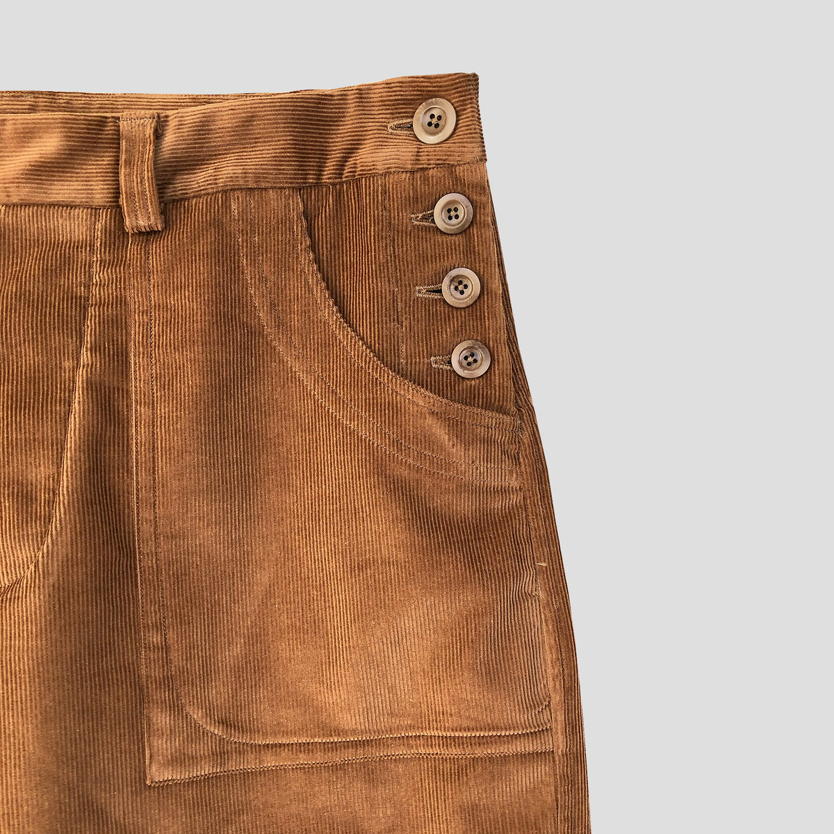 Side button trousers in medium cord