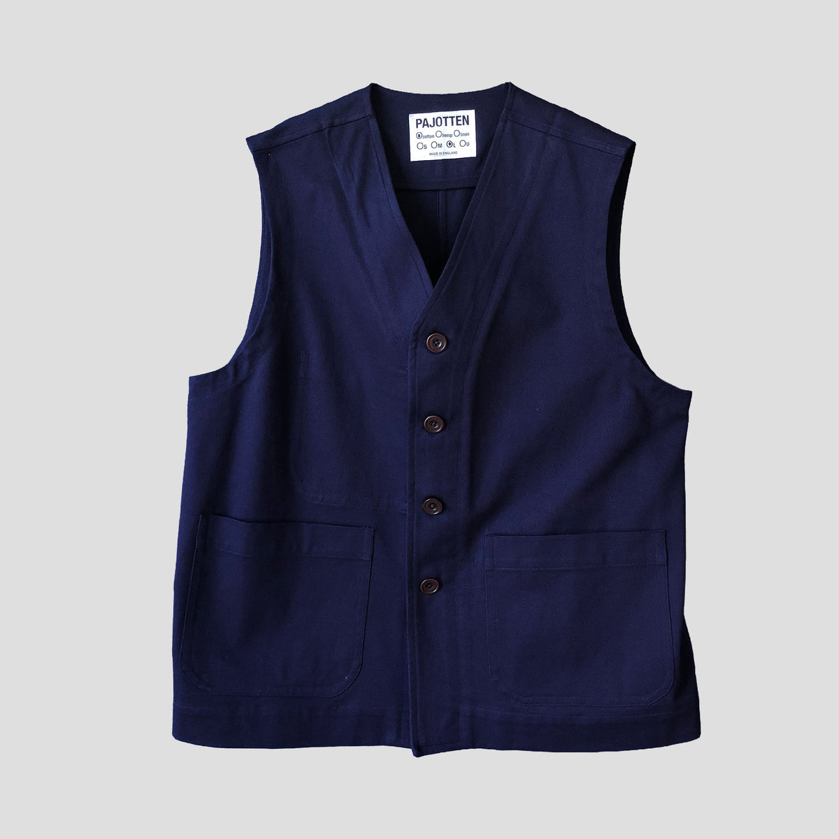 A navy blue linen vest with a button-up front and two front patch pockets, shown flat against a light gray background. The brand label 'Pajotten' is visible inside the collar.