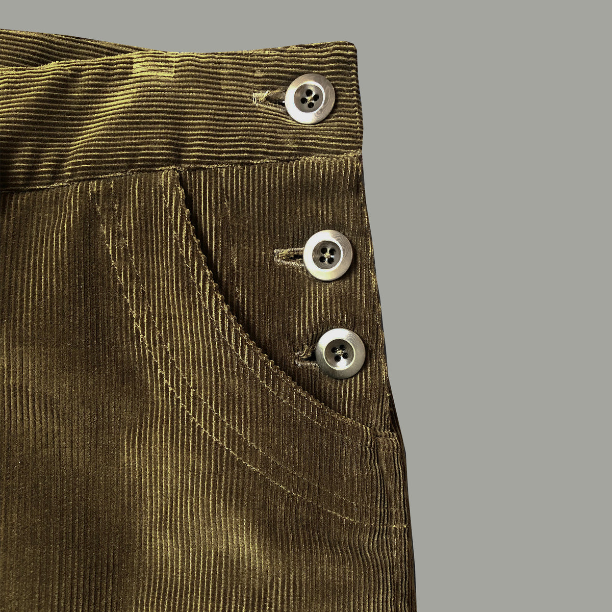 Side button trousers in olive cord